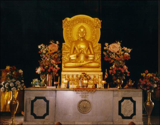 photo of Gupta Era statue of Buddha turning the Wheel of the Dharma in Sarnath's Sri Lankan Mulagandha Kuti Vihara. Sarnath is where Buddha first taught the Buddhist Dharma.